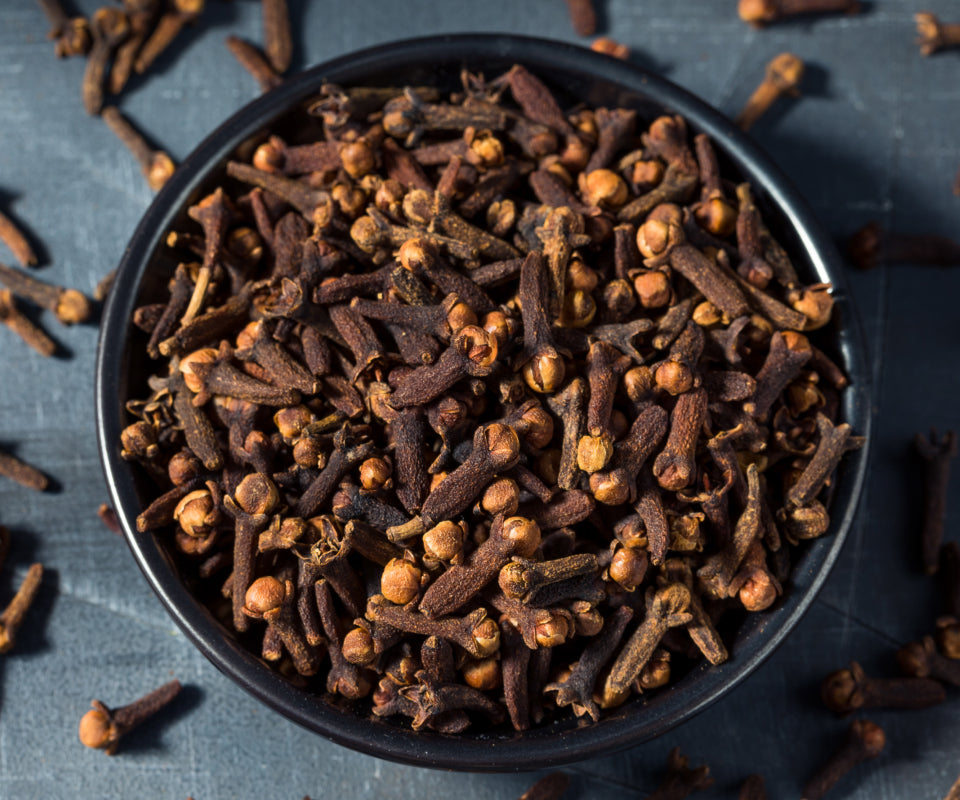 Bowl of whole dried cloves, an ingredient in Krocus & Co. Cinnamon & Clove tea