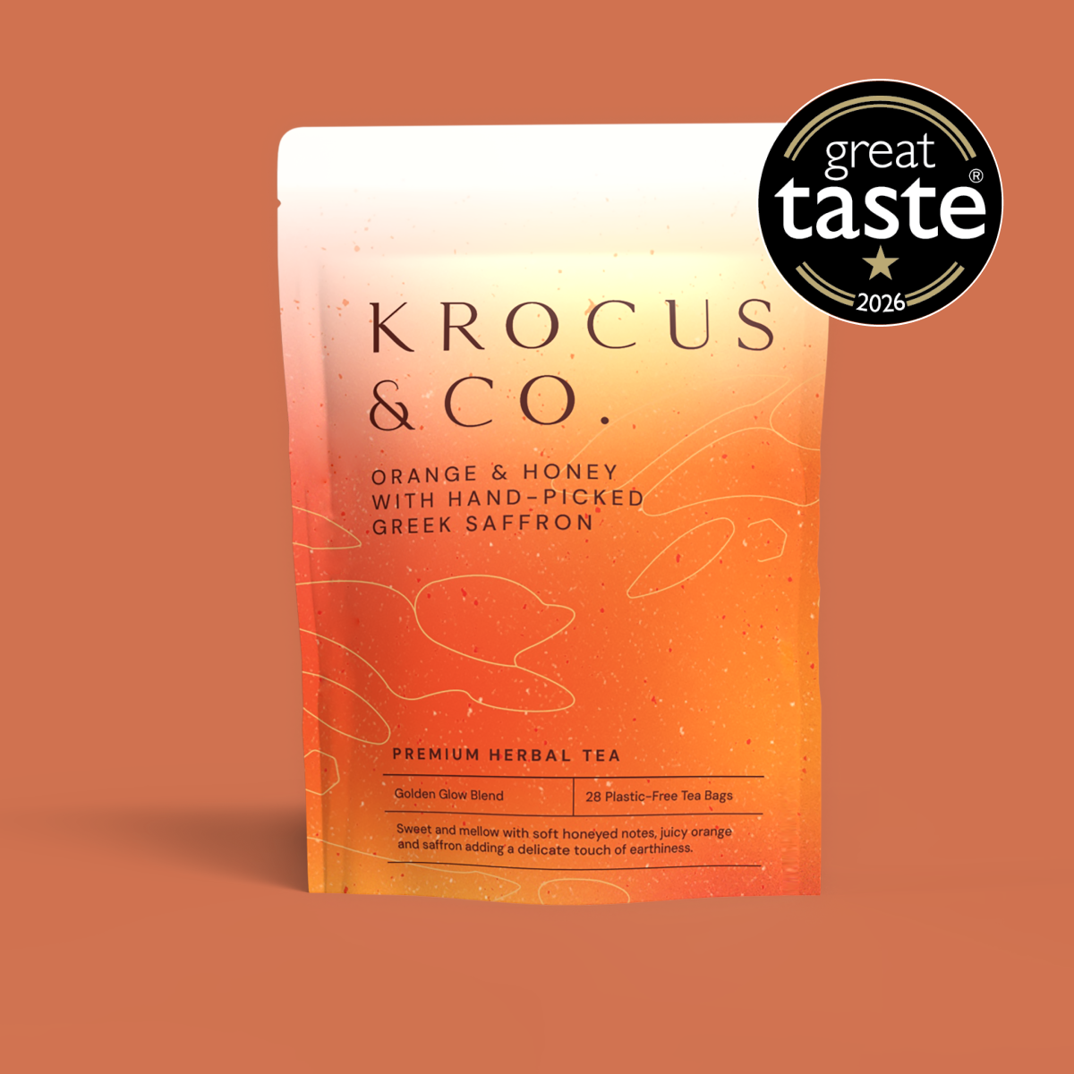 Krocus & Co. Golden Glow Orange & Honey herbal infusion with hand-picked Greek saffron, 28 plastic-free tea bags, Great Taste 2026 one-star award.